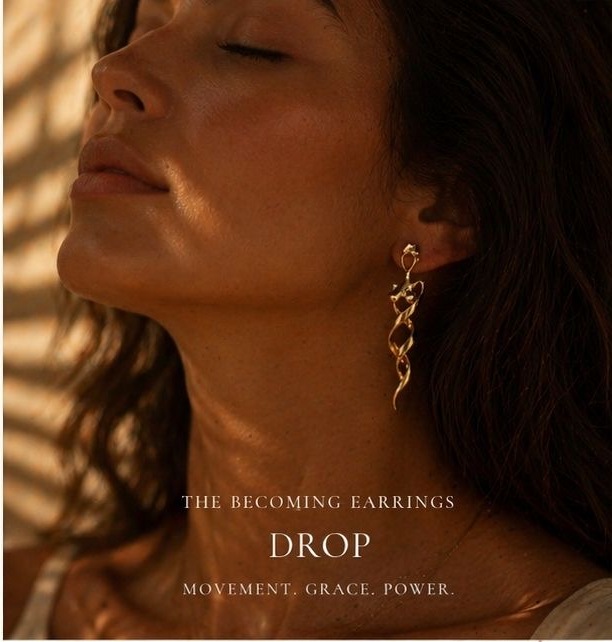 A woman wearing the Becoming Drop earring